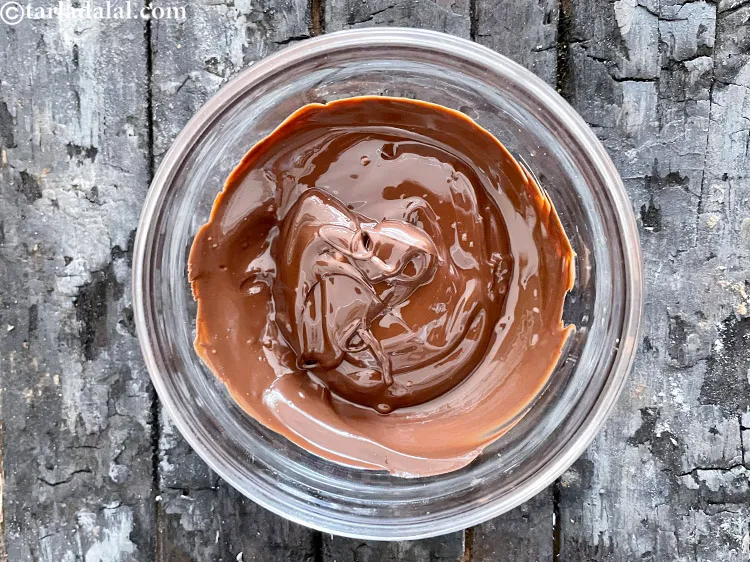 Step 13 – Cool the dark chocolate slightly.