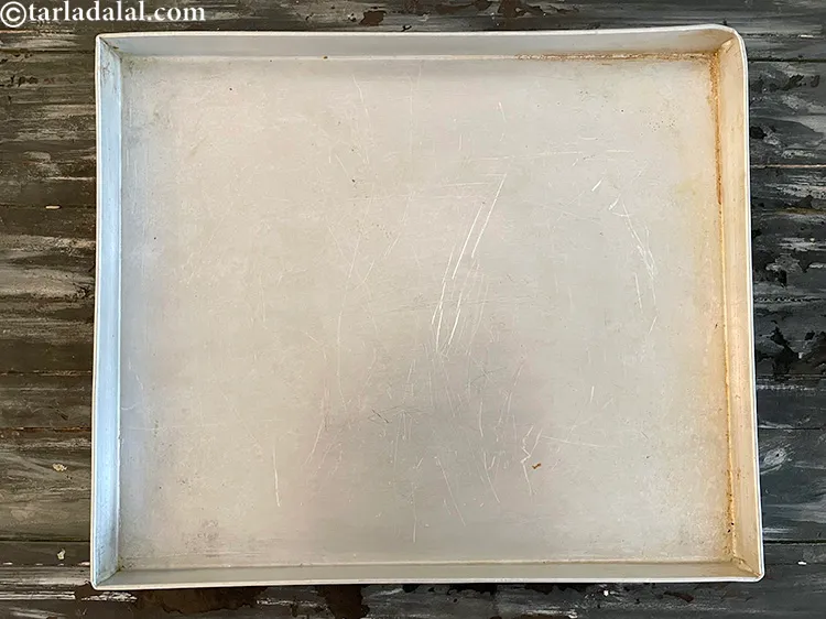 Step 15 – Taking a baking aluminium tray.