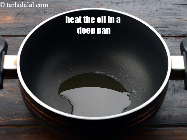 Step 13 – Heat 2 tsp&nbsp;<a href="https://www.tarladalal.com/glossary-oil-671i">oil</a>&nbsp;in a deep non-stick pan.