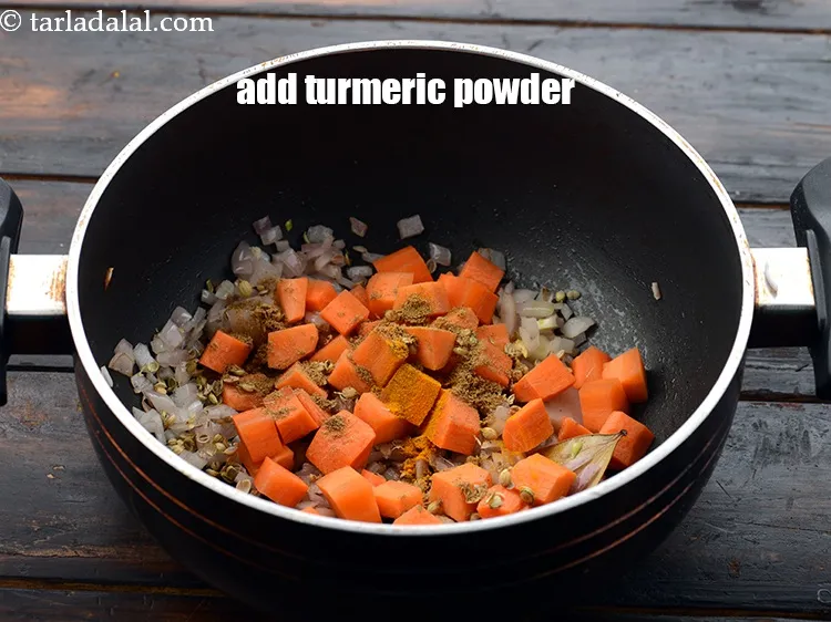 Step 23 – Add a pinch of&nbsp;<a href="https://www.tarladalal.com/glossary-turmeric-powder-haldi-645i">turmeric powder (haldi)</a>.&nbsp;