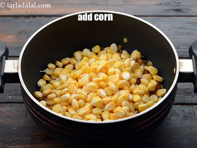 Step 26 – Add 1 1/2 cups&nbsp;<a href="https://www.tarladalal.com/glossary-sweet-corn-kernels-makai-ke-dane-156i">sweet corn kernels (makai ke dane)</a>.&nbsp;