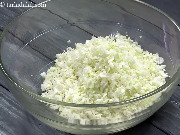 Step 3 – Add 1 1/2&nbsp;cups&nbsp;finely&nbsp;<a href="https://www.tarladalal.com/glossary-chopped-cabbage-781i">chopped cabbage</a>&nbsp;in a deep bowl.&nbsp;
