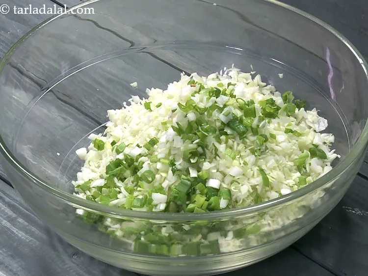 Step 4 – Add 1/4 cup&nbsp;finely&nbsp;<a href="https://www.tarladalal.com/glossary-chopped-spring-onion-whites-815i">chopped spring onions whites</a>&nbsp;and&nbsp;<a href="https://www.tarladalal.com/glossary-chopped-spring-onion-greens-1030i">chopped spring onion greens</a>.