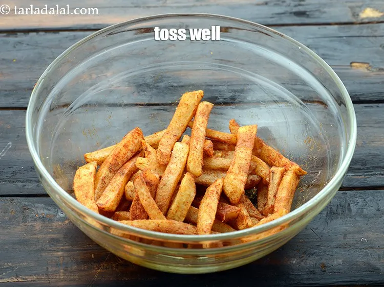 Step 18 – Once you deep-fry the fingers make sure you add the masalas quickly and toss fast …