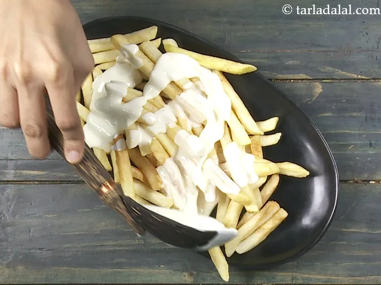 Step 28 – Pour the prepared cheese sauce evenly over it.