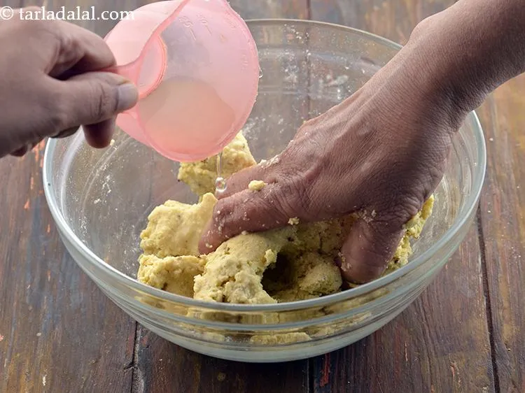 Step 8 – Slowly add water and mix it well. Knead into a soft dough using enough water. …