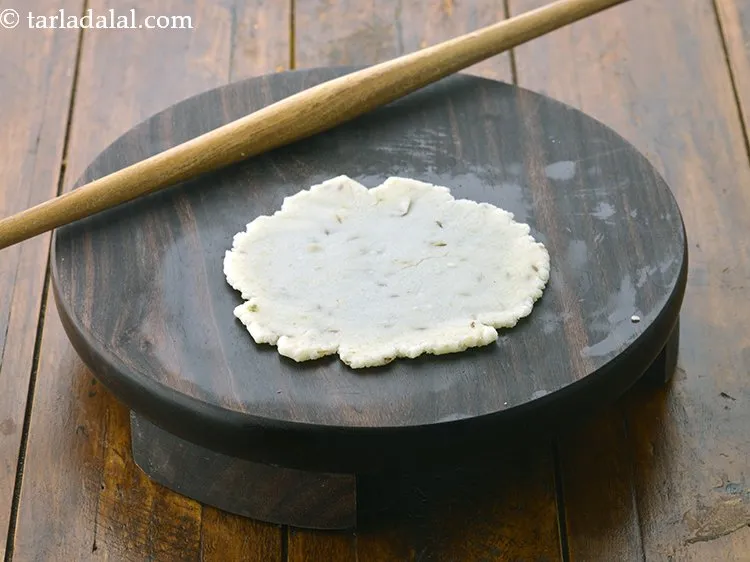 Step 16 – Place a dough portion on it and roll each portion of the dough into a …