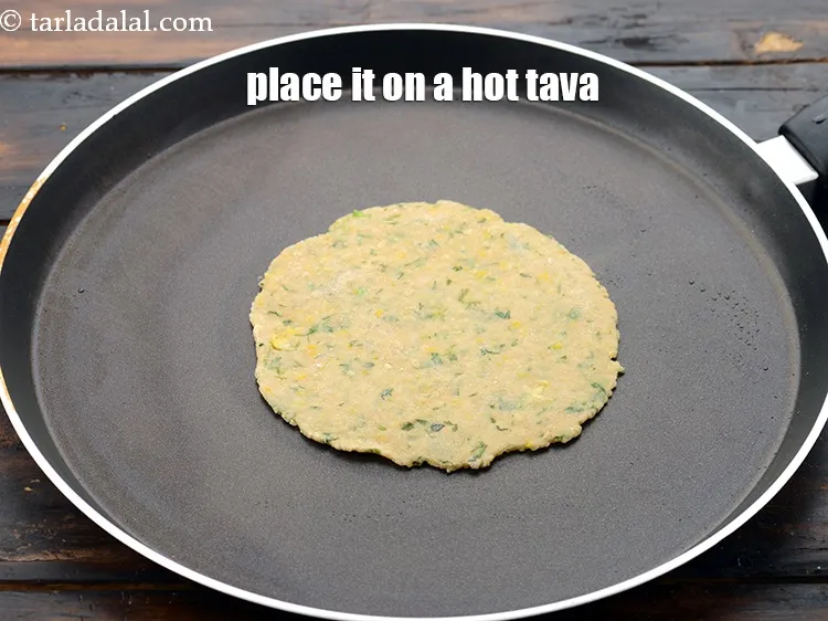 Step 25 – Place it on a hot tava. Let it cook on one side over a medium …