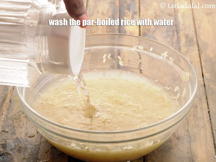 Step 14 – Similarly, wash the par-boiled rice with water.