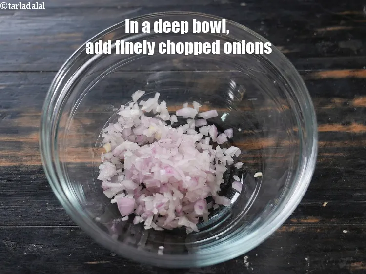 Step 3 – In a deep bowl, add 1/4 cup finely <a href="https://www.tarladalal.com/glossary-chopped-onions-722i">chopped onions</a>.&nbsp;<meta charset="UTF-8" />Onions have a …