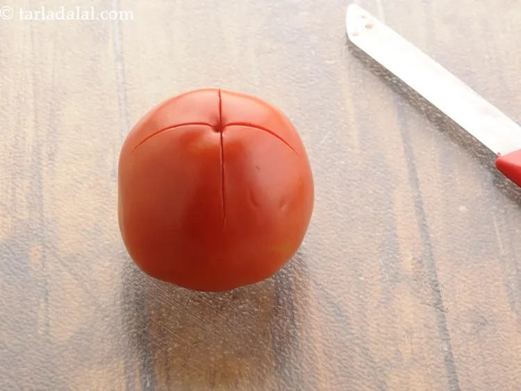 Step 6 – Make a criss-cross cut at the base of each tomato.