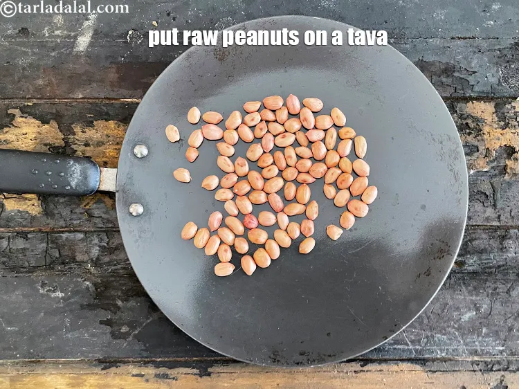 Step 4 – Place raw peanuts on a tava as we are going to roast them.