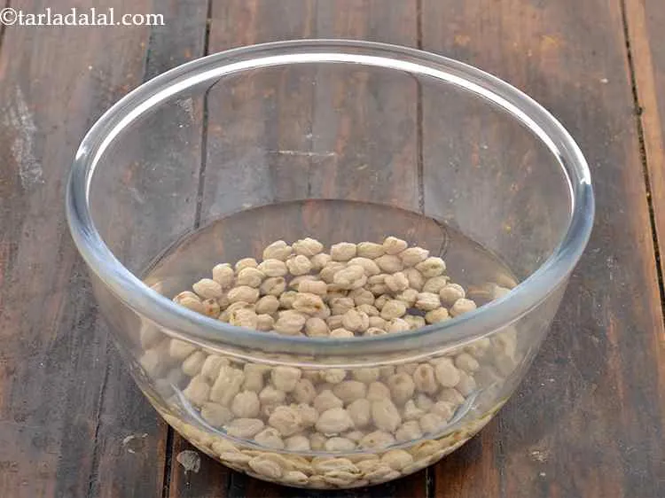 Step 3 – Take approximately 1/2 cup of kabuli chana (chickpeas) in a deep bowl with in enough …