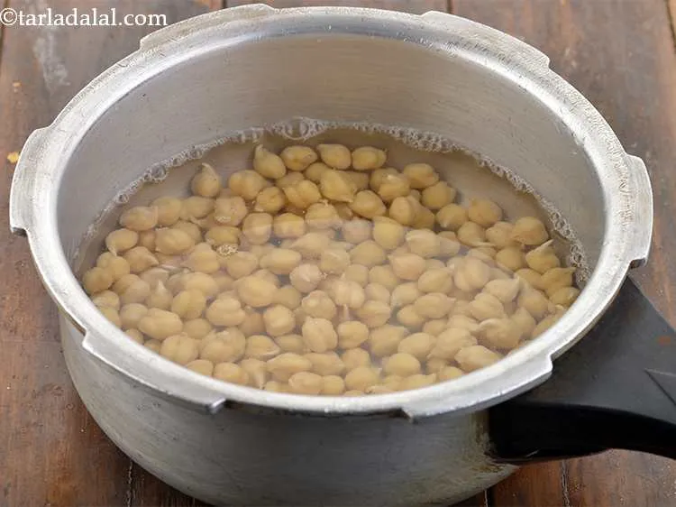 Step 7 – Add enough water and salt and pressure cook for 4 whistles. Here, overcooked chickpeas work …