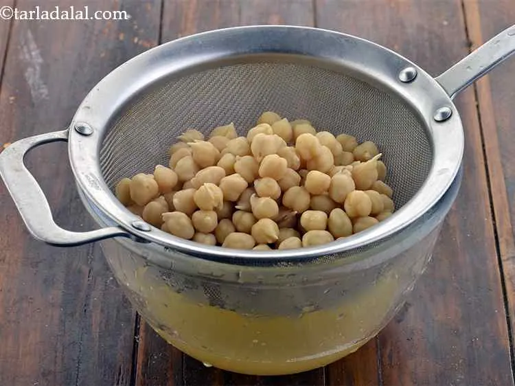 Step 25 – Drain the kabuli chana and keep aside some cooking water of the chickpeas to add …