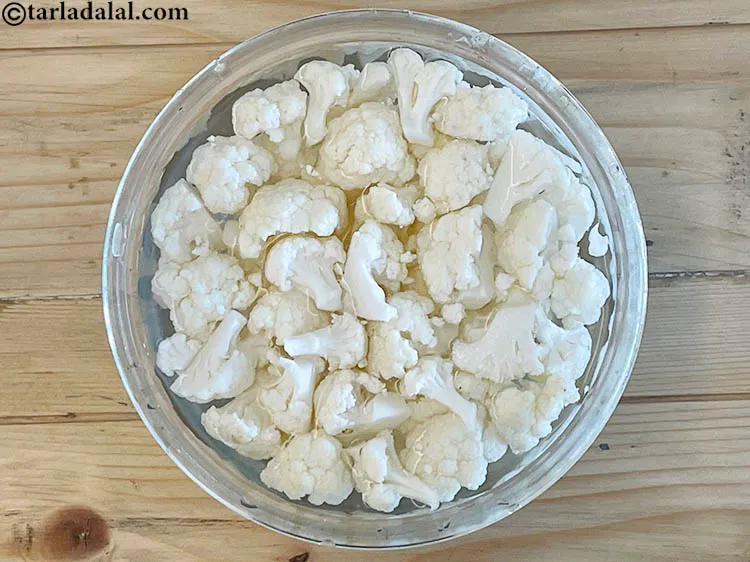 Step 10 – Wash and clean 2 cups&nbsp;<a href="https://www.tarladalal.com/glossary-cauliflower-florets-753i">cauliflower florets</a> thoroughly.&nbsp;Soak in water to remove dirt.