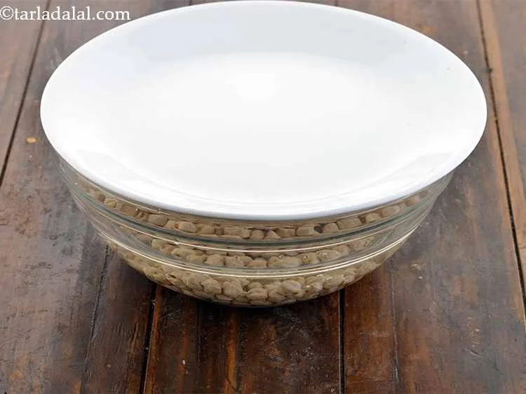 Step 2 – Cover with a lid and let it soak overnight. The chickpeas will double in size. …