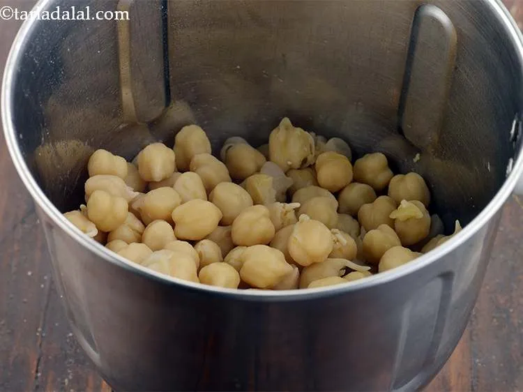 Step 19 – Drain if required and in a mixer jar, take the cooked chickpeas