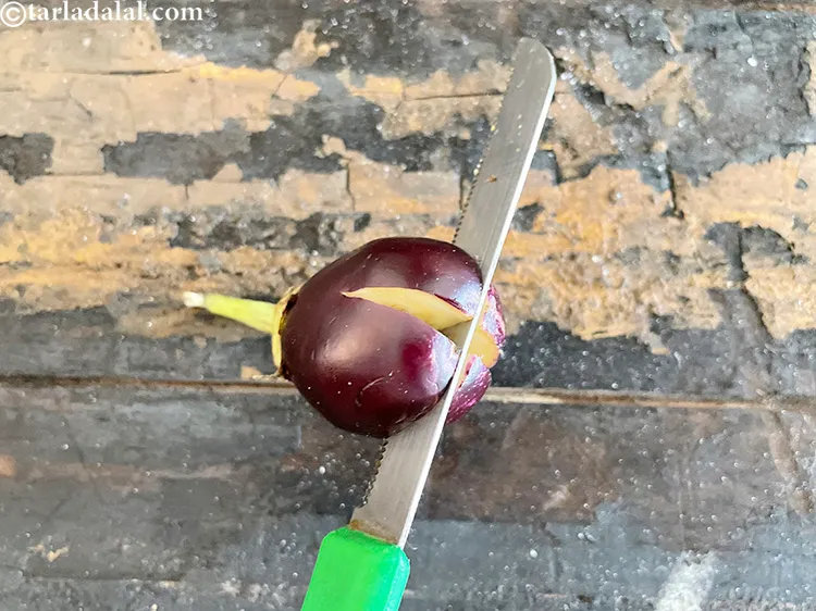 Step 24 – Slit the brinjals from the top or&nbsp;lengthwise. This will make 4 small slits on the …