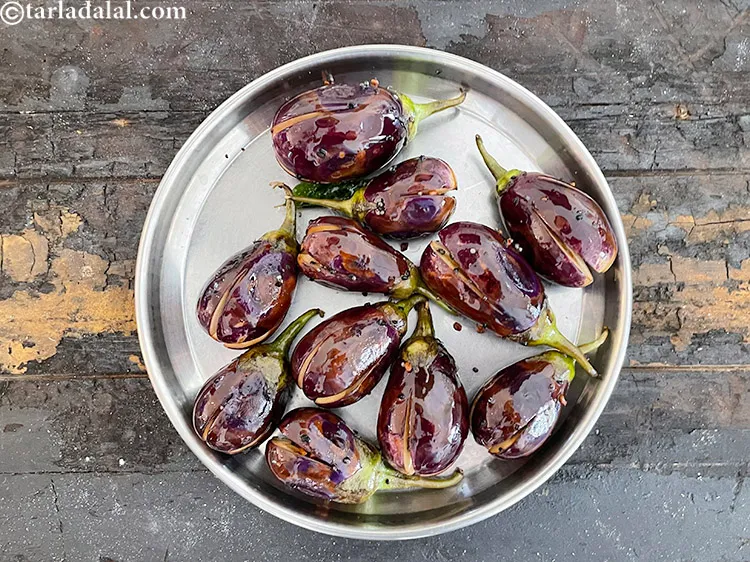 Step 35 – Remove the brinjals and keep aside.