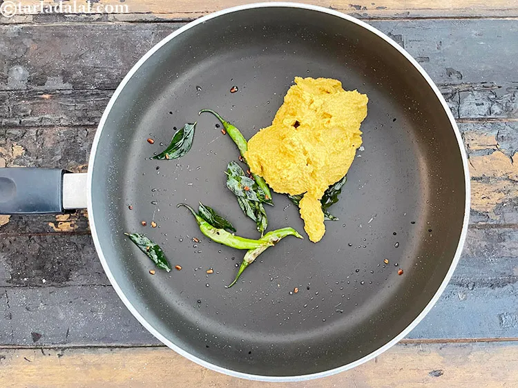 Step 36 – In the same pan, add the coconut and sesame paste.