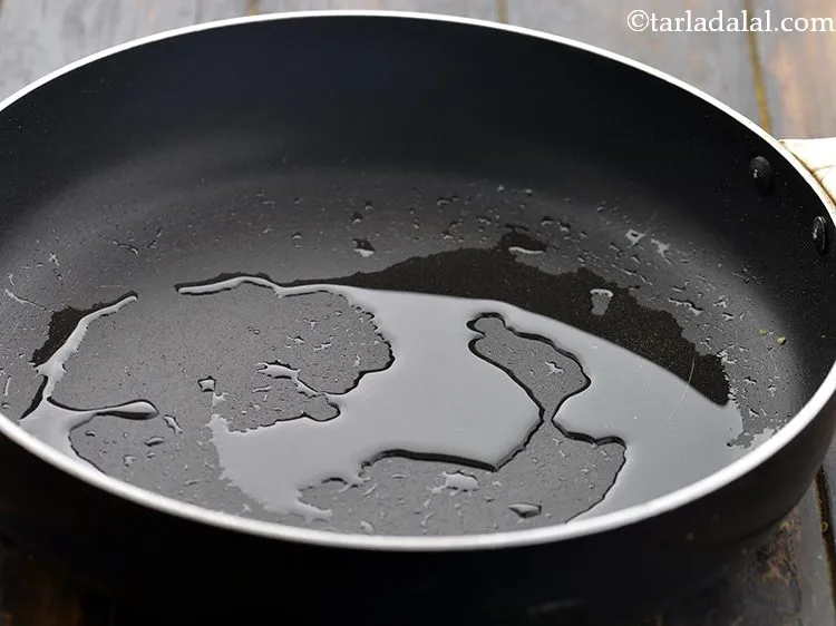 Step 7 – Heat the remaining 1&frac12; tbsp oil in the same broad non-stick pan.