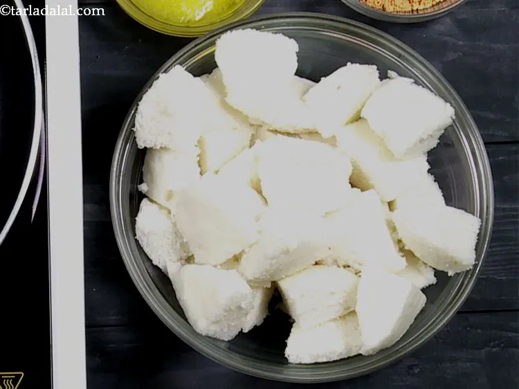 Step 21 – To make ghee <strong>podi idli</strong>, firstly prepare soft, steamed idli using our recipe for <a …