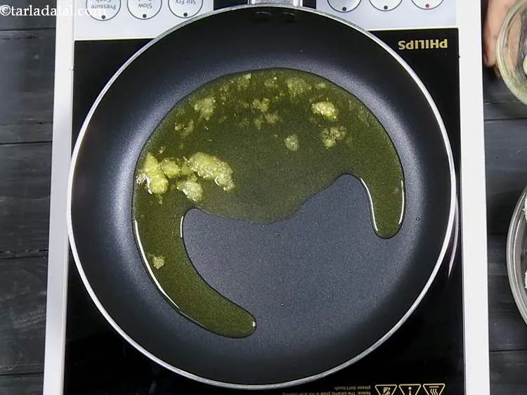 Step 22 – For making the&nbsp;<strong>Idli Milagai Podi, Idli Podi</strong>, heat the ghee in a broad non-stick pan. …