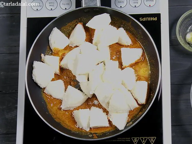 Step 25 – Add the idlis.&nbsp;<strong>Idli Milagai Podi, Idli Podi</strong>&nbsp;can be made with mini idlis or regular idli.