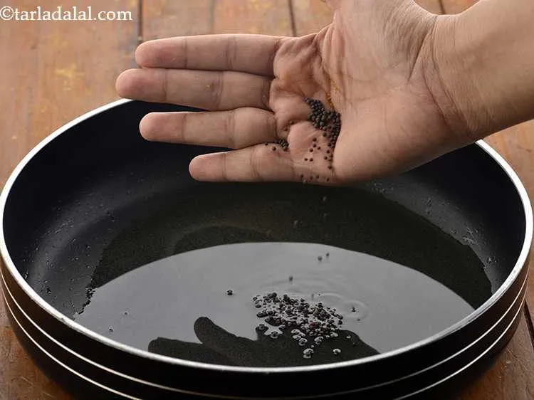 Step 4 – Once the oil is hot, add the mustard seeds. Urad dal, chana dal, cumin seeds …