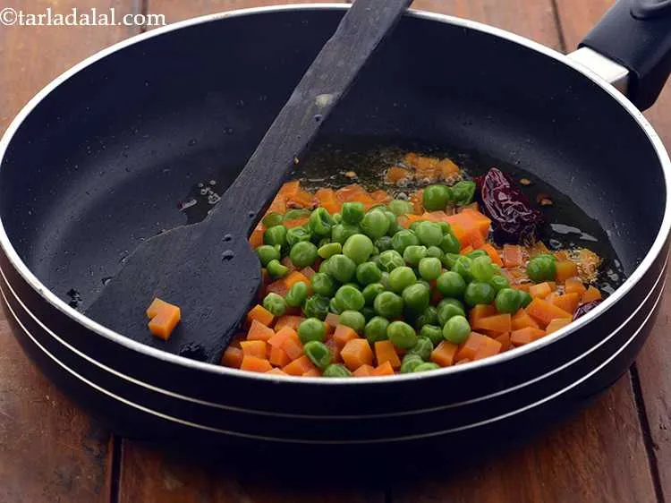Step 8 – Add the green peas.