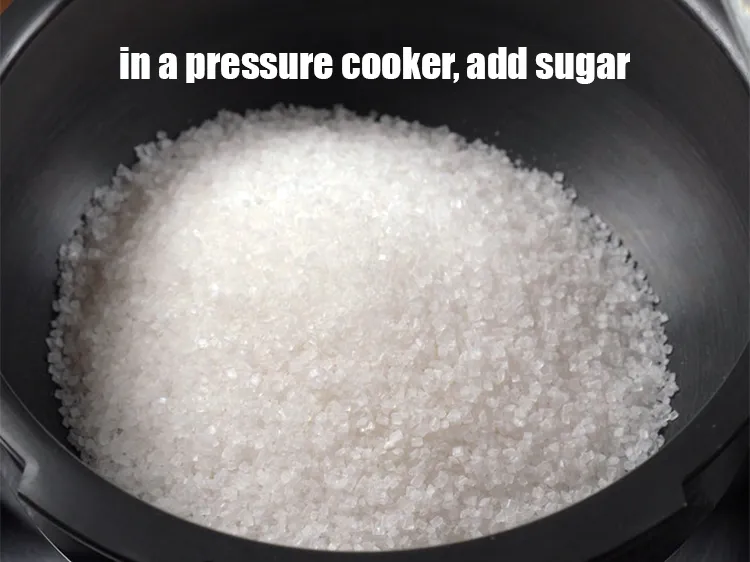 Step 13 – In a deep pan , add 2 cups sugar.