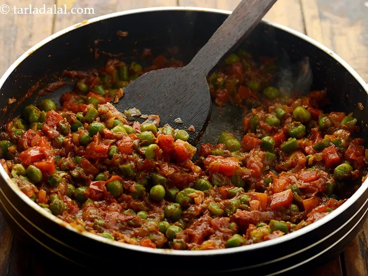 Step 20 – Add 2 tbsp of water and cook on medium flame for 1 minute, while stirring …