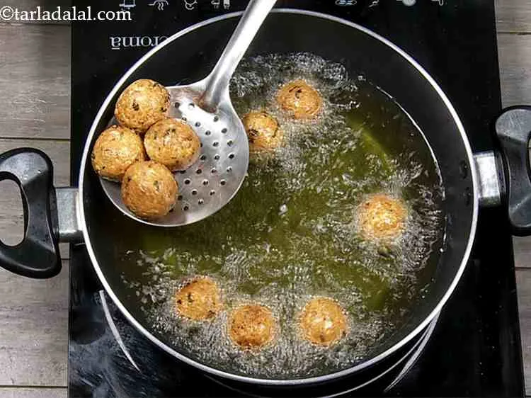 Step 29 – Deep fry till they turn golden brown in colour from both the sdies. These balls …