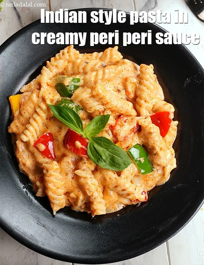 Step 28 – Serve <strong>peri peri pasta</strong> immediately with garlic bread.&nbsp;