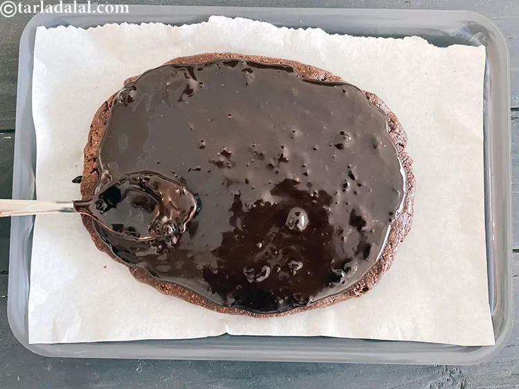 Step 22 – Add more melted chocolate to cover the entire chocolate base.