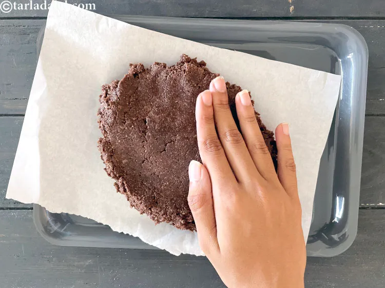 Step 19 – Spread the mixture on a tray covered with butter paper. &nbsp;Pat the mixture down with …