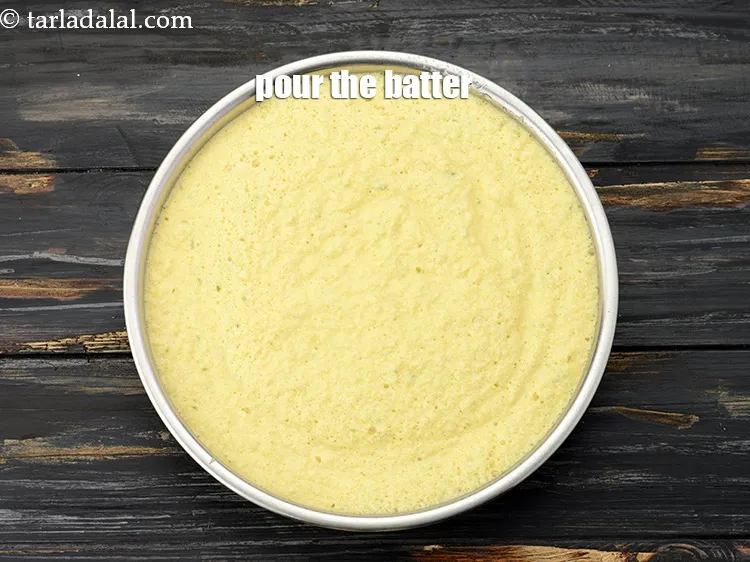 Step 17 – Pour the batter into a greased 175 mm. (7&rdquo;) diameter thali.