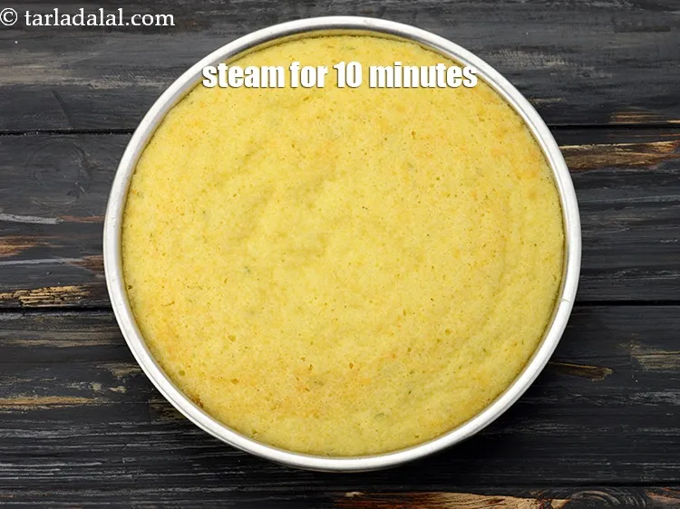 Step 18 – Steam in a steamer for 10 minutes or till the dhoklas are cooked. Keep aside.