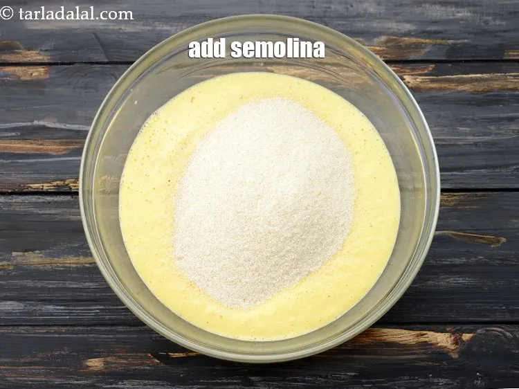 Step 7 – Add 1 cup&nbsp;<a href="https://www.tarladalal.com/glossary-semolina-sooji-rava-rawa-603i">semolina (rava)</a>, we have used the regular rava which we use for …