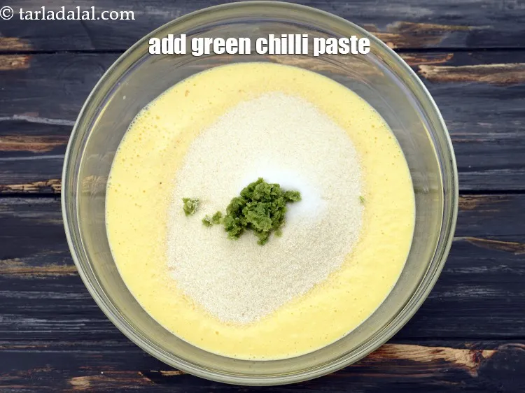 Step 9 – Add 2 tsp&nbsp;<a href="https://www.tarladalal.com/glossary-green-chilli-paste-hari-mirch-ki-paste-mirchi-paste-333i">green chilli paste</a>.