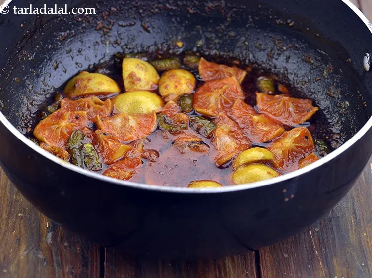 Step 33 – After adding the lemons, salt and fenugreek-asafoetida mixture, remember to cook it on a slow …