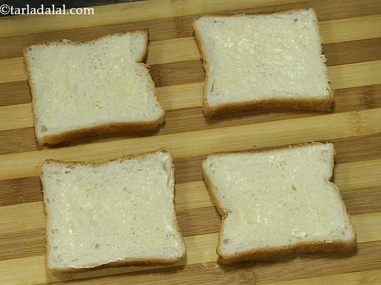 Step 11 – Spread ? tsp of butter on each bread slice.