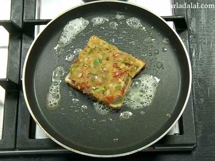 Step 15 – Place a toast on it with the topping side facing upwards and cook it on …