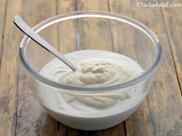 Step 17 – To make the aval idli batter, combine the two ground mixtures using a round ladle.