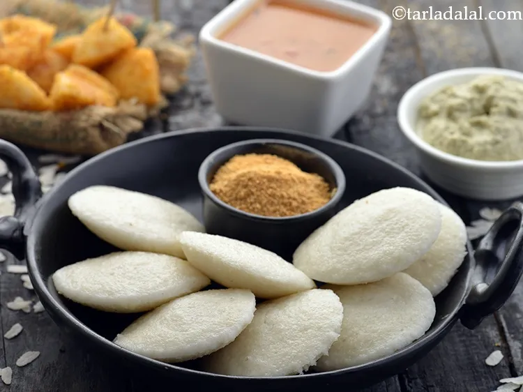 Step 30 – Serve the <strong>instant poha idli (</strong>&nbsp;<strong>instant aval idli)&nbsp;</strong>hot with <a href="https://www.tarladalal.com/Sambhar-(-How-To-Make-Sambhar-South-Indian-Recipe)-32735r" target="_blank">sambhar</a> and <a href="https://www.tarladalal.com/Coconut-Chutney--(-Idlis-and-Dosas)-1653r" …
