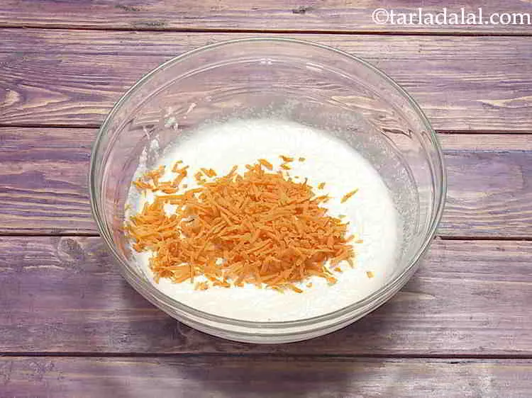 Step 6 – Now add a myriad of vegetables like grated carrot.