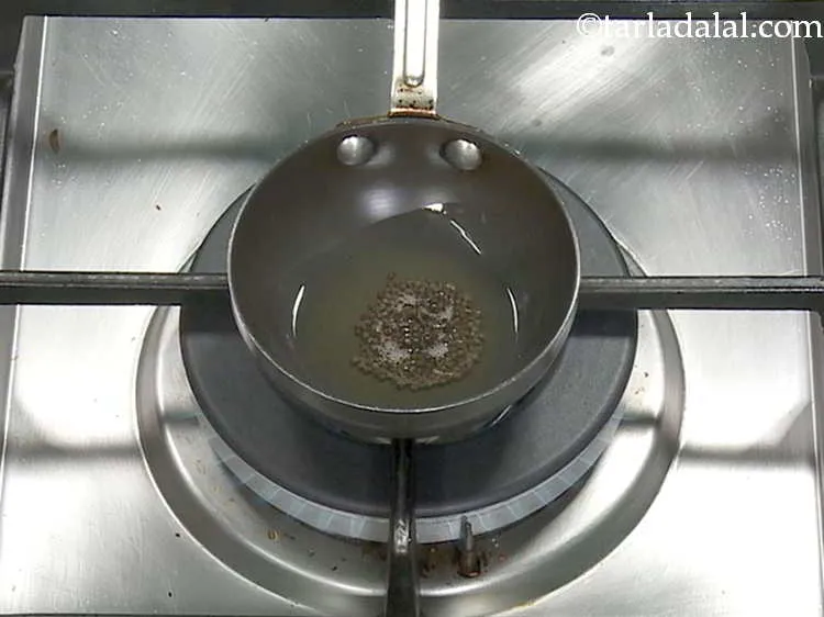 Step 11 – Heat the oil in a small non-stick pan, add the mustard seeds.