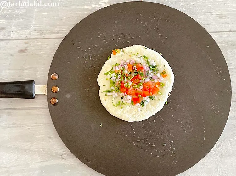 Step 20 – Again pour a little oil over the <strong>instant rava uttapam |&nbsp;jhatpat suji uttapam | onion …