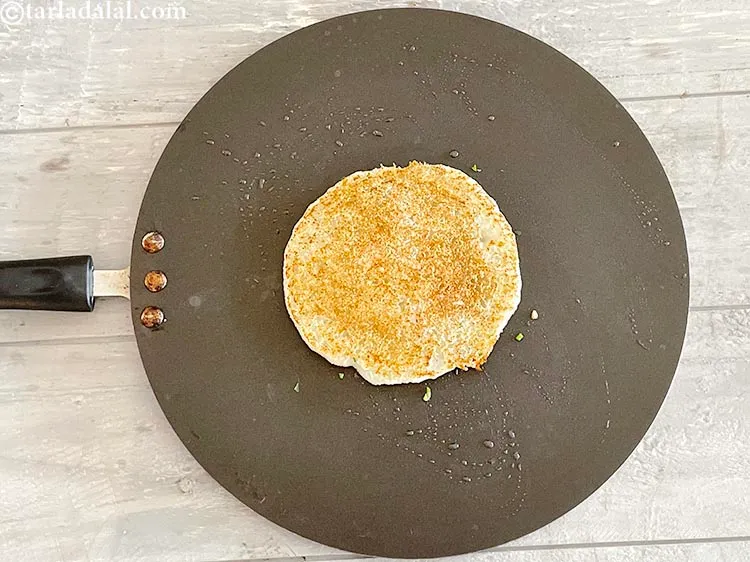 Step 21 – Flip over and cook the<strong>&nbsp;rava uttapam |&nbsp;jhatpat suji uttapam | onion tomato rava uttapam</strong> |.